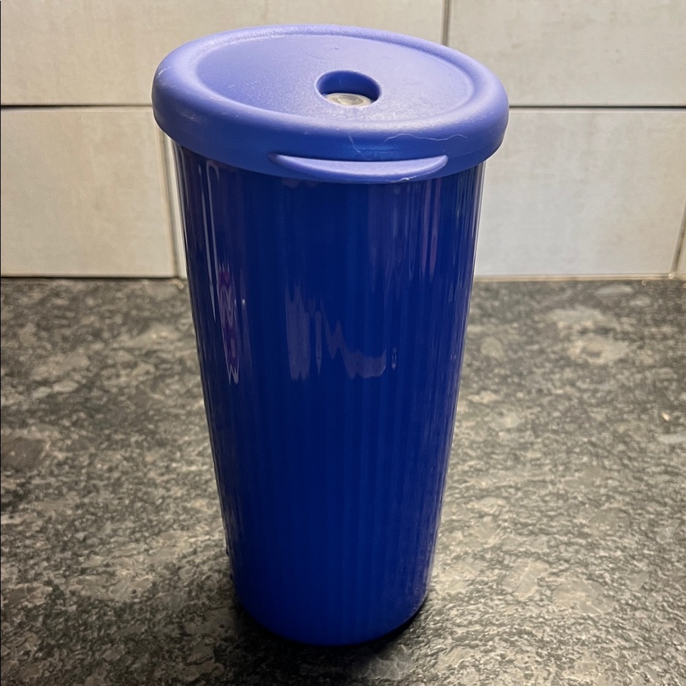 24 oz Purple Tupperware Tumbler with Lid. NWOT. Keeps drinks cold.